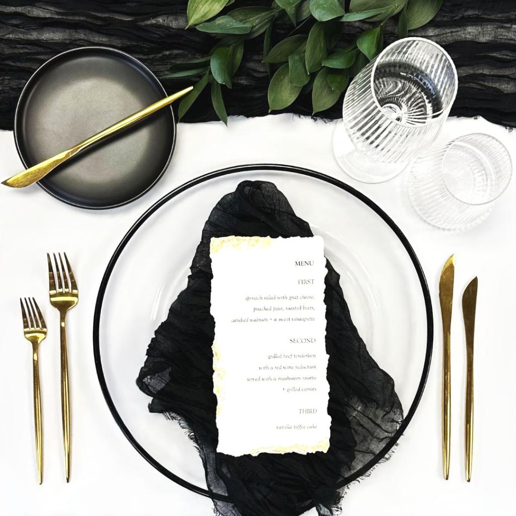 Modern place setting with gold and black accents